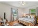 Bright bedroom with hardwood floors, abundant natural light, and minimalist decor at 1849 Clay Sw Rd, Mableton, GA 30126