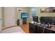 Bedroom featuring hardwood floors, TV, and minimalist design, creating a functional and stylish workspace at 1849 Clay Sw Rd, Mableton, GA 30126