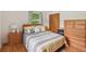 Cozy bedroom with hardwood floors, natural light, and traditional wood furniture at 1849 Clay Sw Rd, Mableton, GA 30126