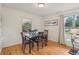 Cozy dining room features a classic table set, hardwood floors, and a bright window, perfect for Gathering meals at 1849 Clay Sw Rd, Mableton, GA 30126