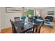 Inviting living room with blue furnishings, hardwood floors, and an abundance of natural light at 1849 Clay Sw Rd, Mableton, GA 30126