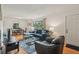 Bright living room with hardwood floors, cozy seating, and large windows, creating a warm and inviting space at 1849 Clay Sw Rd, Mableton, GA 30126