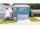 Back exterior with a screened porch, a two-car garage, and a manicured lawn at 1922 Perry Nw Blvd, Atlanta, GA 30318
