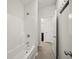 Bathroom featuring a shower and tub combo with white walls and tile floors at 1922 Perry Nw Blvd, Atlanta, GA 30318