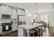 Modern kitchen boasts stainless steel appliances, a granite island, and pendant lighting at 1922 Perry Nw Blvd, Atlanta, GA 30318