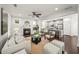 Bright living room with fireplace flows into kitchen, creating an inviting open-concept living space at 1922 Perry Nw Blvd, Atlanta, GA 30318