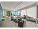 Relaxing sunroom with comfortable seating offers serene views of the outdoors at 1922 Perry Nw Blvd, Atlanta, GA 30318