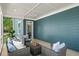 Covered sunroom with plush seating area provides a peaceful place to relax at 1922 Perry Nw Blvd, Atlanta, GA 30318