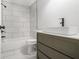 Bathroom featuring modern vanity with sink and tile shower with shower head at 2803 3Rd Sw Ave, Atlanta, GA 30315
