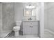 Bathroom featuring a gray tiled shower, a modern vanity, and ample storage at 2803 3Rd Sw Ave, Atlanta, GA 30315