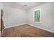 Bedroom showcasing hardwood floors and a window that overlooks the outside at 2803 3Rd Sw Ave, Atlanta, GA 30315