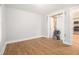 Bedroom with unfinished walls, hardwood floors, and doorway to another room at 2803 3Rd Sw Ave, Atlanta, GA 30315