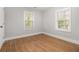 Bedroom showcasing hardwood floors, two windows, and light-colored walls at 2803 3Rd Sw Ave, Atlanta, GA 30315