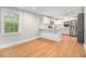Modern kitchen with white cabinets, stainless steel appliances, and wood flooring at 2803 3Rd Sw Ave, Atlanta, GA 30315