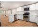 Modern kitchen with stainless steel appliances, white cabinets, and countertop at 2803 3Rd Sw Ave, Atlanta, GA 30315