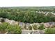 Aerial view of the neighborhood showcasing the houses, mature trees, and residential setting at 4084 Fort Sumter Nw Lndg, Acworth, GA 30101