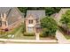 An aerial view of a brick house with manicured landscaping and a well-maintained lawn at 4084 Fort Sumter Nw Lndg, Acworth, GA 30101