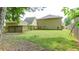 Expansive backyard with green lawn and partial fencing, offering room for recreation and relaxation at 4084 Fort Sumter Nw Lndg, Acworth, GA 30101