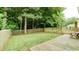 Large fenced backyard with a wooden deck and lush green lawn, providing privacy and space at 4084 Fort Sumter Nw Lndg, Acworth, GA 30101