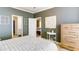 Bedroom showcasing a bed, decor, light walls and flooring, and interior doorway at 4084 Fort Sumter Nw Lndg, Acworth, GA 30101