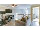 Inviting bonus room with a comfortable sofa, exercise bike, and a view of an adjacent room at 4084 Fort Sumter Nw Lndg, Acworth, GA 30101