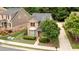 Charming front exterior with manicured landscaping, brick facade, and a well-maintained lawn at 4084 Fort Sumter Nw Lndg, Acworth, GA 30101