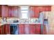 Kitchen with stainless steel appliances, granite countertops, tiled backsplash, and cherry wood cabinets at 4084 Fort Sumter Nw Lndg, Acworth, GA 30101