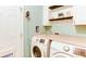 Laundry room with a washer and dryer next to cabinets and a pet door at 4084 Fort Sumter Nw Lndg, Acworth, GA 30101