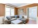 Cozy living room featuring a comfortable couch, ottoman and large window at 4084 Fort Sumter Nw Lndg, Acworth, GA 30101