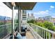 Relaxing balcony featuring comfortable seating with stunning views of the city skyline at 855 Peachtree Ne St # 501, Atlanta, GA 30308