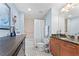 Bathroom features a tub, wooden cabinets, granite countertop, and modern fixtures at 855 Peachtree Ne St # 501, Atlanta, GA 30308