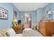 Light blue room featuring a desk and chest of drawers at 855 Peachtree Ne St # 501, Atlanta, GA 30308