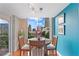 Cozy dining area with large window offering cityscape views and ample natural light at 855 Peachtree Ne St # 501, Atlanta, GA 30308