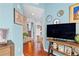 Hallway featuring sleek wood floors, modern decor, and an open view into other living spaces at 855 Peachtree Ne St # 501, Atlanta, GA 30308