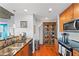 Kitchen with stainless appliances and wood-look flooring at 855 Peachtree Ne St # 501, Atlanta, GA 30308