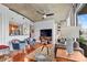 Inviting living room featuring modern decor, wood floors, and balcony access with city views at 855 Peachtree Ne St # 501, Atlanta, GA 30308