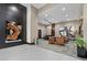Elegant lobby with modern decor, seating, and artistic wood accent, creating a welcoming entrance at 855 Peachtree Ne St # 501, Atlanta, GA 30308