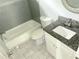 Bathroom featuring granite counters, subway tile and combination tub and shower at 1539 Beecher Sw St, Atlanta, GA 30310