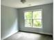 Bedroom featuring window and neutral carpet at 1539 Beecher Sw St, Atlanta, GA 30310