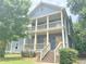 Charming two-story home with a spacious porch on both floors, offering ample outdoor living space at 1539 Beecher Sw St, Atlanta, GA 30310