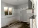 The kitchen has a large window and white subway tile walls at 1539 Beecher Sw St, Atlanta, GA 30310