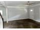 Spacious living room with hardwood floors, white walls, and a large front door at 1539 Beecher Sw St, Atlanta, GA 30310