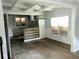 Open living area featuring hardwood floors, with access to kitchen and dining area at 1539 Beecher Sw St, Atlanta, GA 30310