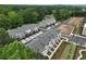 Aerial view of a residential community with townhomes, landscaping, and parking at 1980 Deco Dr, Kennesaw, GA 30144