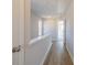 Upstairs hallway with wood floors and white walls at 1980 Deco Dr, Kennesaw, GA 30144