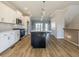Modern kitchen with white cabinets, stainless steel appliances, and a large island at 1980 Deco Dr, Kennesaw, GA 30144