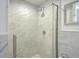 Updated bathroom showcases tiled shower with glass door and neutral color palette at 215 Piedmont Ne Ave # 1406, Atlanta, GA 30308
