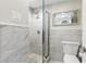 Modern bathroom features glass enclosed shower with attractive tile and new fixtures at 215 Piedmont Ne Ave # 1406, Atlanta, GA 30308