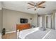 Cozy bedroom offers hardwood floors, a ceiling fan, and access to the bathroom at 215 Piedmont Ne Ave # 1406, Atlanta, GA 30308