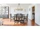 Elegant dining room with hardwood floors, stylish lighting, and seating for six at 215 Piedmont Ne Ave # 1406, Atlanta, GA 30308